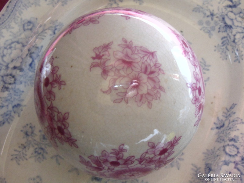 Porcelain sphere with pink floral on a cream-white background