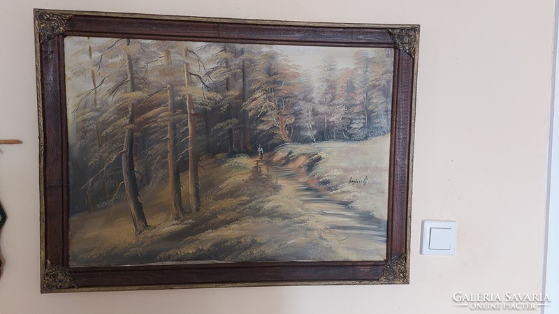 (K) landscape painting with a small female figure signed in a 76x55 cm frame