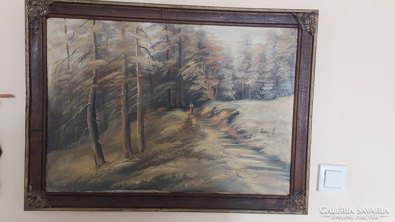 (K) landscape painting with a small female figure signed in a 76x55 cm frame