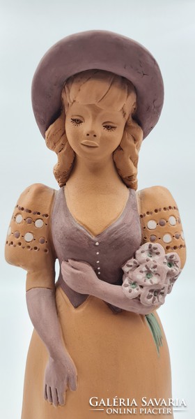 Girl in hat with ceramic statue (marked fz)