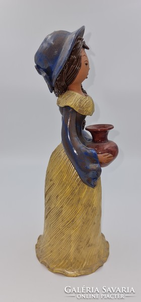 Katalin Sződi with a ceramic jug