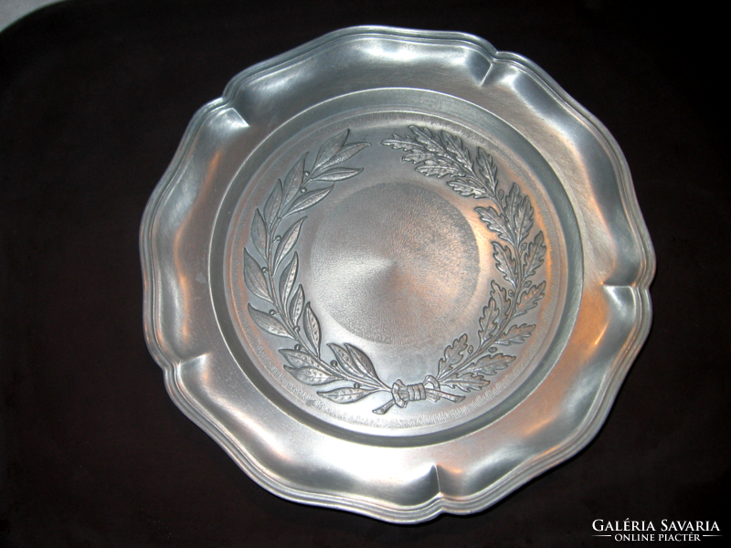 Antique pewter wall plate with laurel wreath pattern, angel mark