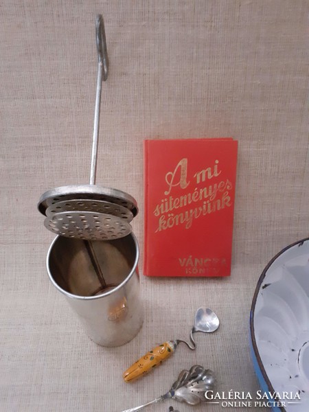 Old kitchen utensils in one enamel casserole oven spit, cookie cakes spoons cake book