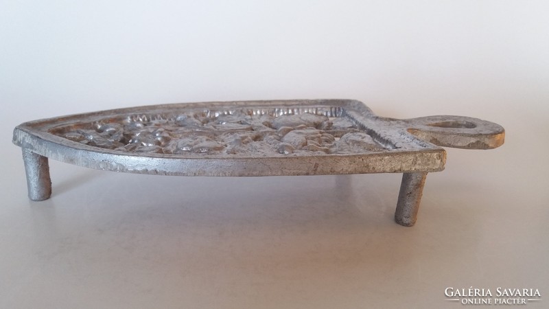 Old iron iron holder with rose pattern, vintage floral ironing board