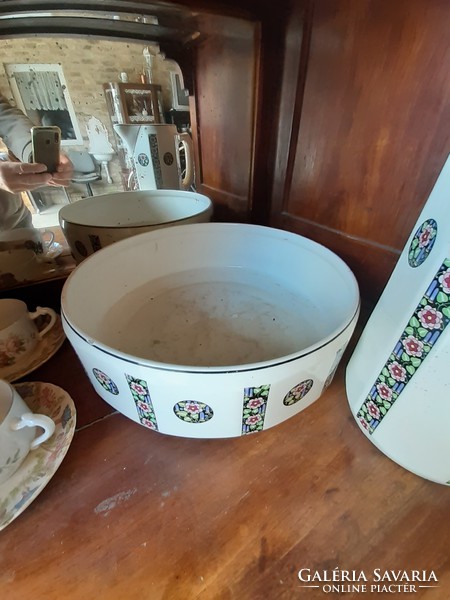Porcelain washbasin with jug serving.