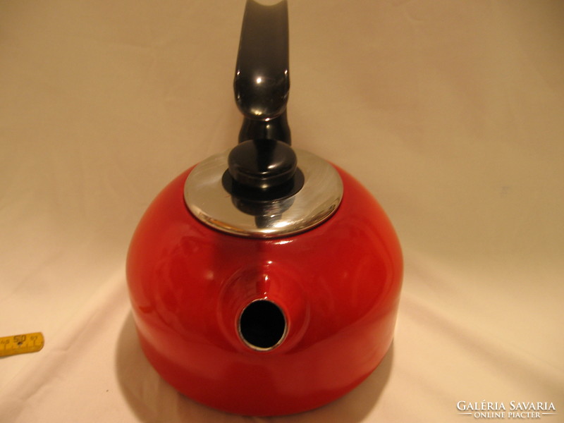 Retro enameled red kettle with teapot