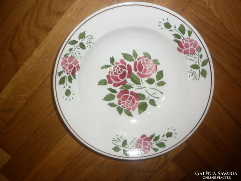 Old floral pest on granite faience wall plate