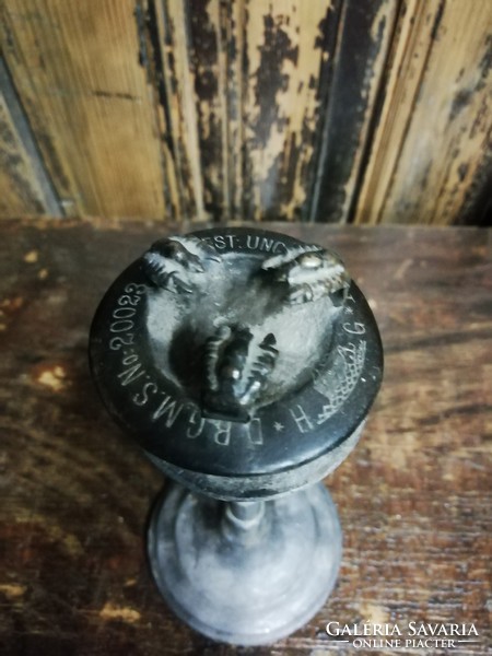 Candlestick and candle holder with clawed patent mark, perhaps used on ships