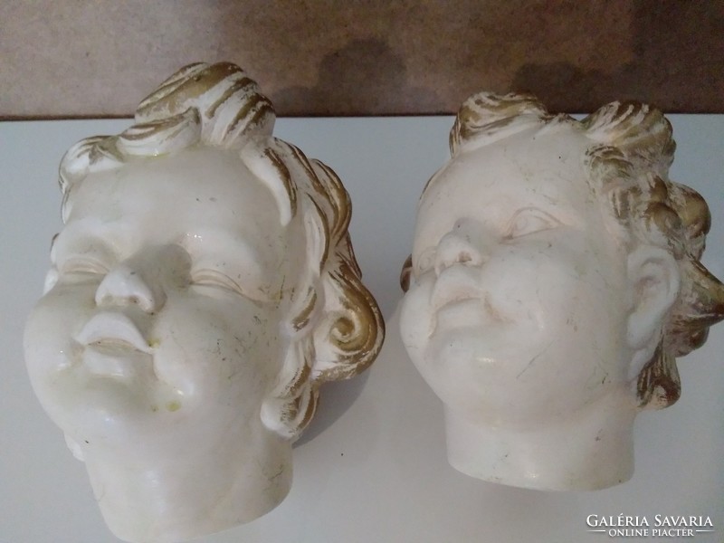 Ceramic putto heads