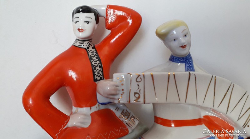 Retro Russian porcelain statue of a folk dancer in folk costume with an accordion dancer