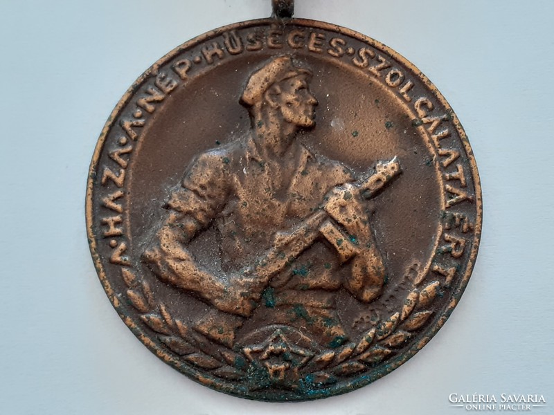 An old medal of the home for the faithful service of the people is a badge