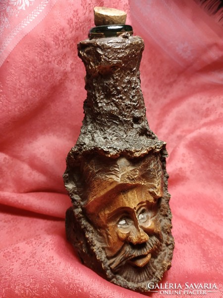 Interesting decorative glass with a wooden head