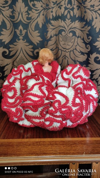A vintage marked doll in an extreme ruffled crocheted dress could have been a bed decoration or a target shooting prize