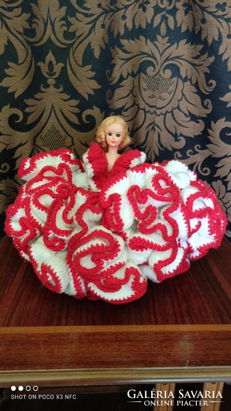 A vintage marked doll in an extreme ruffled crocheted dress could have been a bed decoration or a target shooting prize
