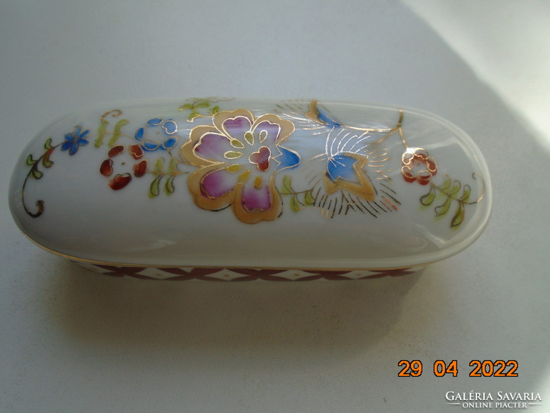 Antique hand painted oval porcelain box with gold contoured floral patterns