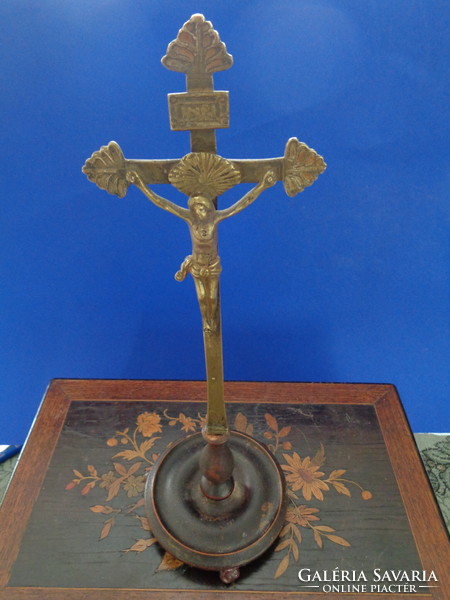 Antique copper cross on wooden base