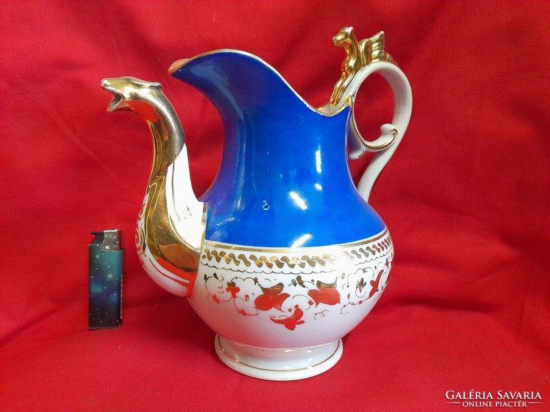 Old gilded figural porcelain spout and jug.
