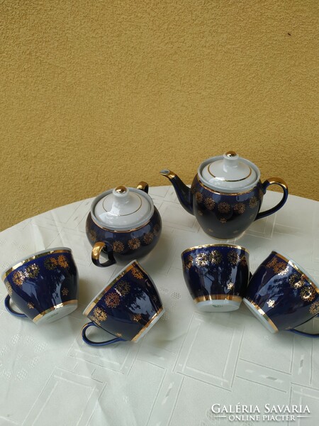 Porcelain, cobalt blue tea set decorated with gold for sale!