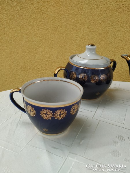 Porcelain, cobalt blue tea set decorated with gold for sale!
