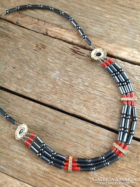 Hematite necklace decorated with noble coral with gold-plated silver ornaments and fittings