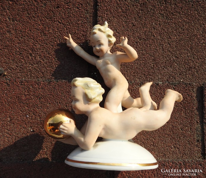 Antique German eagle figure: naked children playing ball