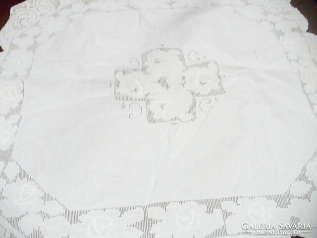 Toledo and embroidered white tablecloth