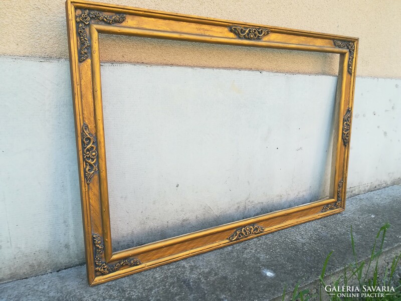 Beautiful wooden picture frame. Nest: 80x50 cm. Color: gold, antique.