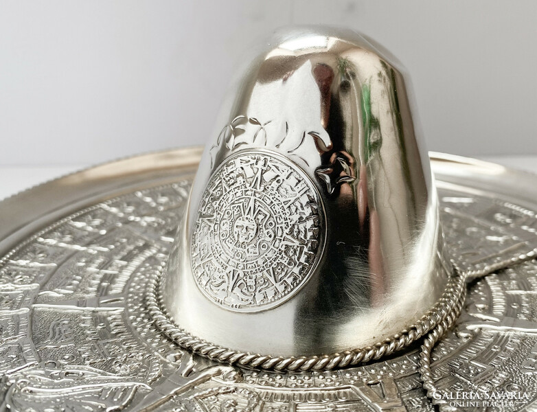 Ornate Mexican sombrero ornament bowl on silver.