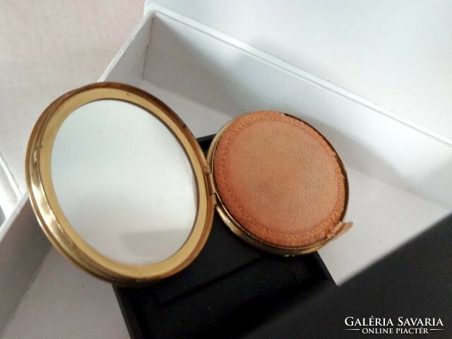 Powder with a compact mirror and a beautiful 