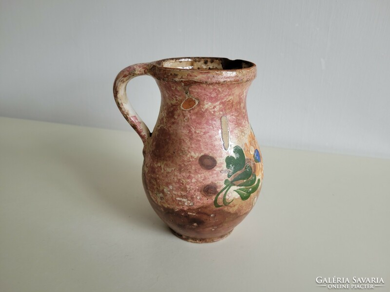 Old vintage folk earthenware milk jug flower pattern glazed vessel spout jug earthenware jug