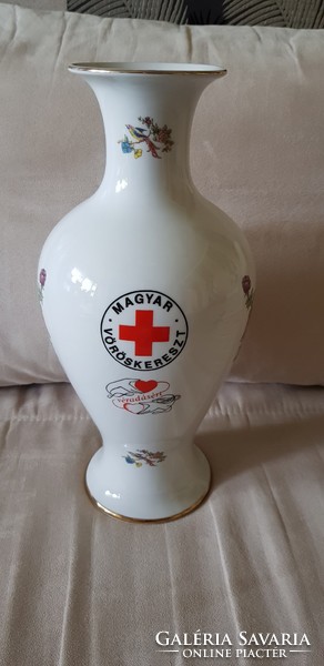Vase of a bird of paradise in a raven house. Hungarian red cross. For blood donation.