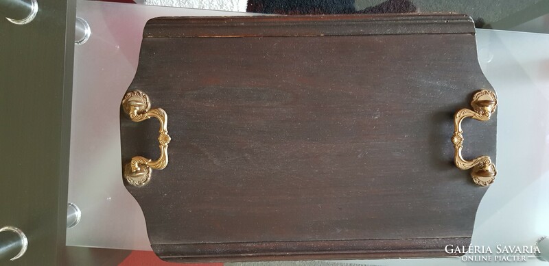 Old wooden tray with copper handle.