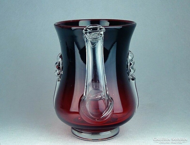 Beautiful jug made of burgundy blown glass