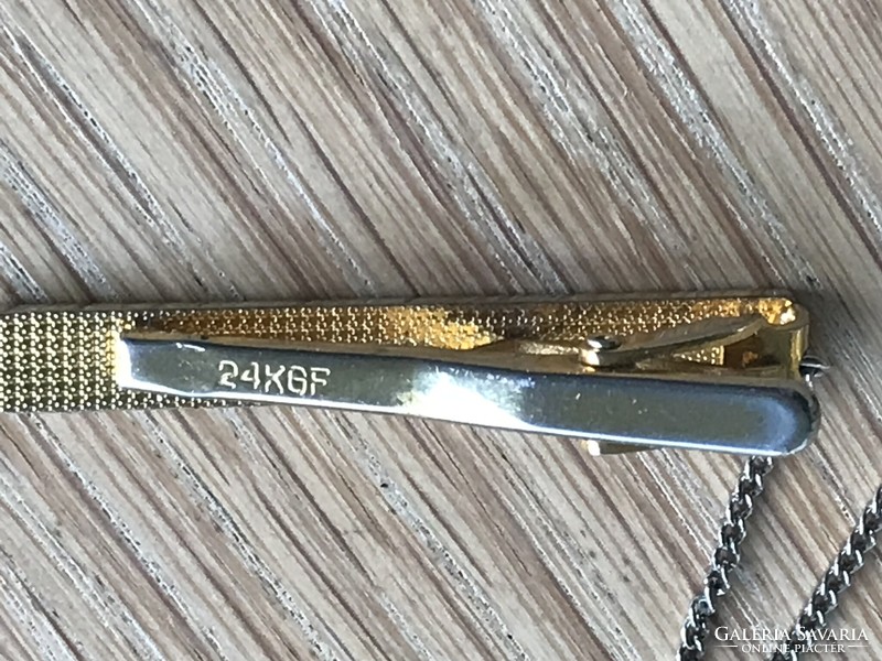 Chanel tie tweezers with 24 carat gold plating,