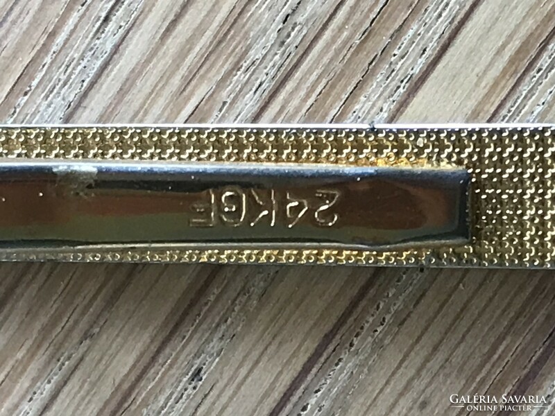 Chanel tie tweezers with 24 carat gold plating,