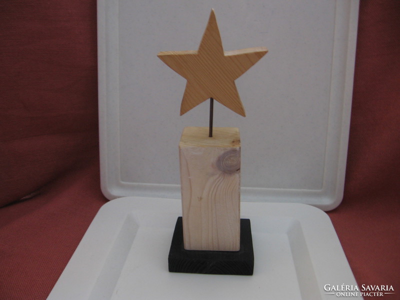 Christmas decoration with metal stars on wooden base