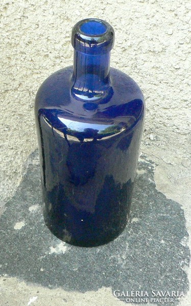 Antique blue thick-walled glass bottle