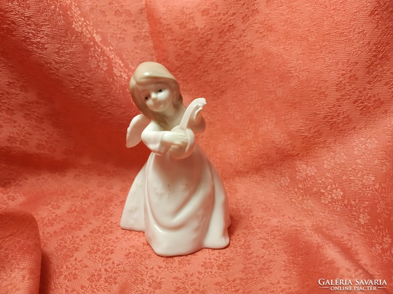 Charming porcelain musical angel