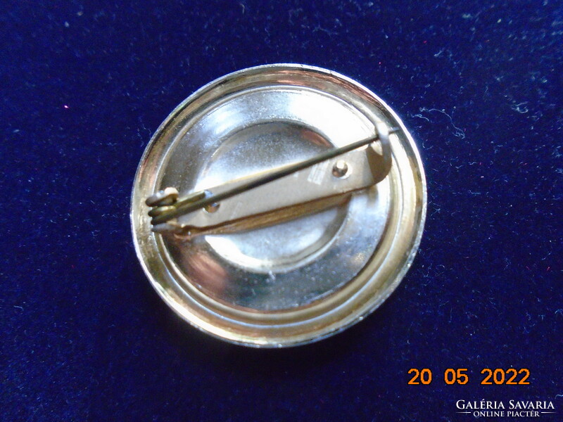 Gilded brooch with pink porcelain insert