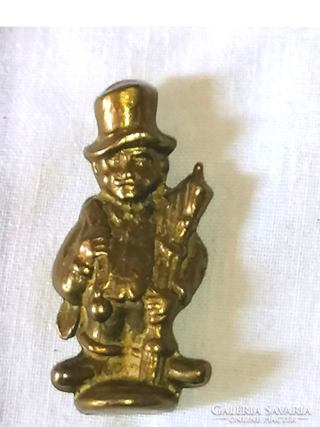 Little boy with a brass hat, copper ornament, copper figure