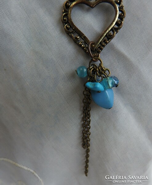 Double heart pendant necklace with blue hanging stones on leather strap
