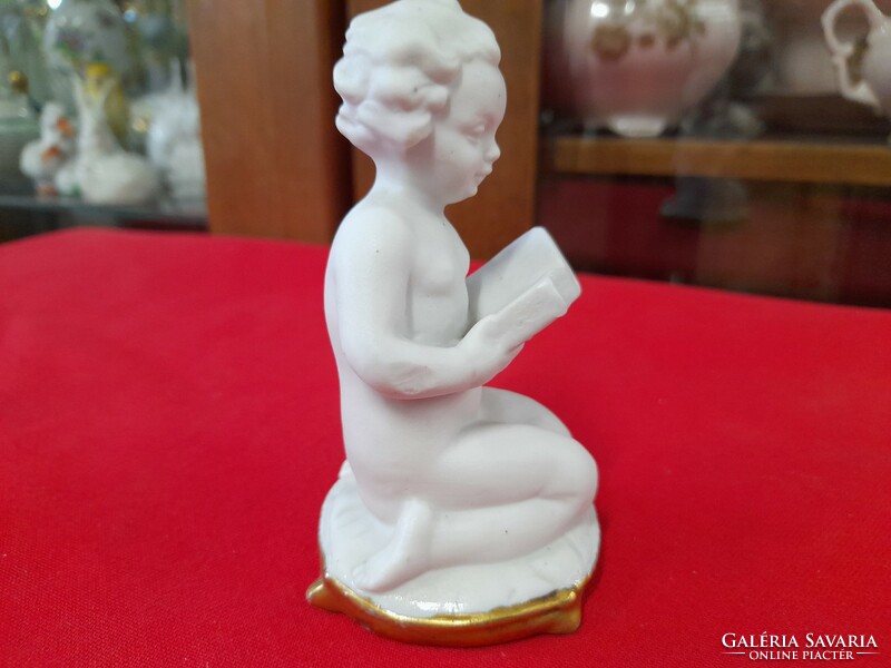 Old Italian capodimonte reading kid porcelain figurine.
