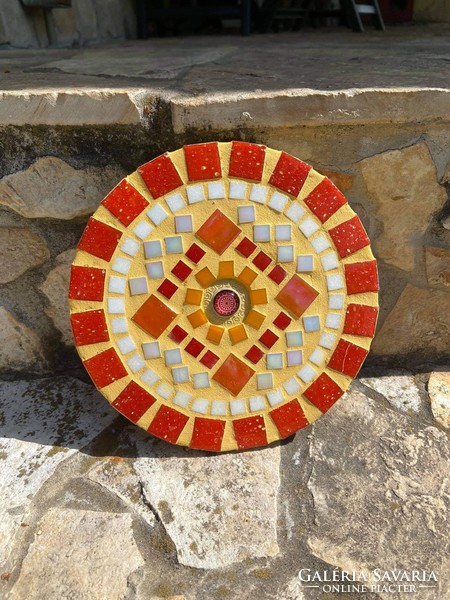 Glass mosaic mandala mural in warm colors: red, orange
