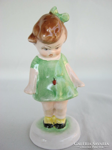 Bodrogkeresztúr ceramic little girl in a green dress with a ladybug