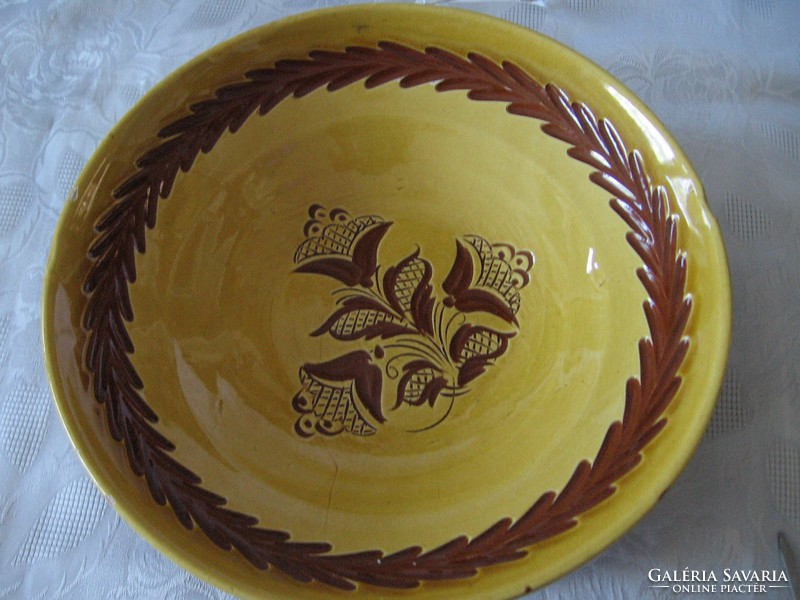 A good large pottery tile bowl that can be hung on the wall