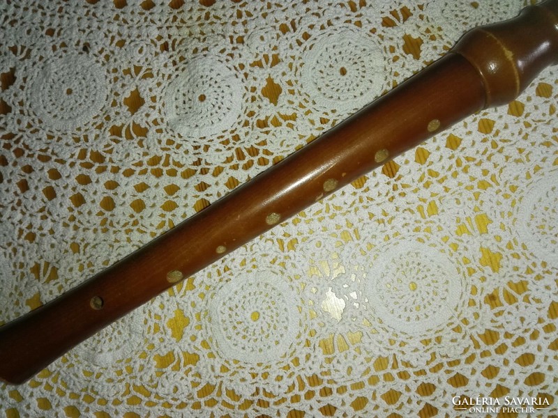 Golden, wooden flute.