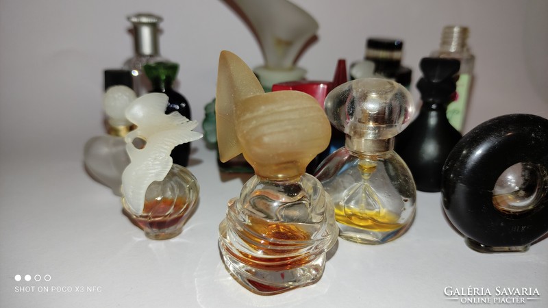 Vintage perfume bottles with a drop of quality fragrance, many pieces together