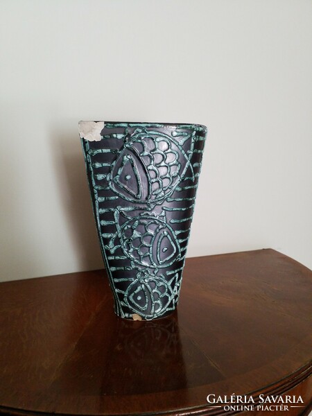Defective cucumber fish in a ceramic vase