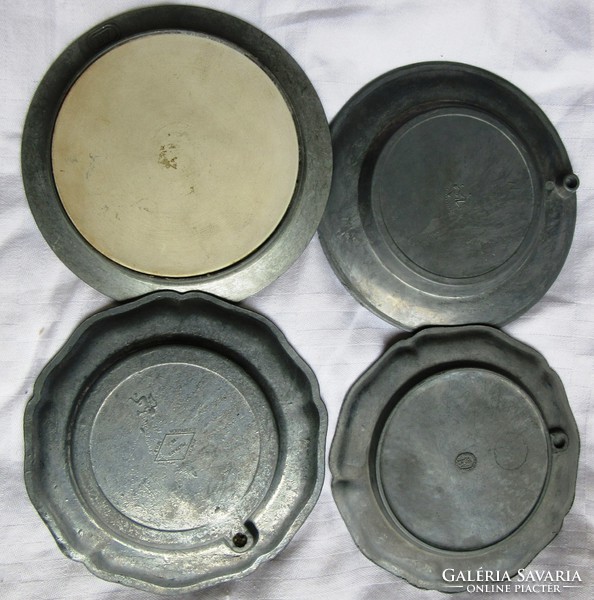 4 tin plates with porcelain inserts, diameter 11, 11.2, 10 cm.