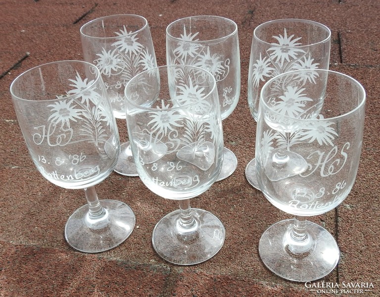 Set of old, hand-polished snowflake patterned monogrammed and vintage wine glasses